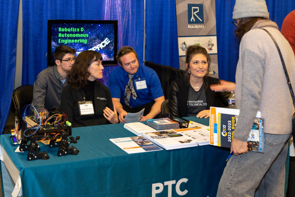A Pittsburgh Robotics Discovery Day attendee speaks with about career pathways with an exhibitor.